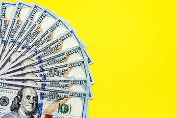 Cash on the table, yellow background, money, us dollars, place for text, flat lay,  space for text - obrazy, fototapety, plakaty