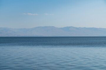 Water landscape. Beautiful lake under blue sky with clouds.