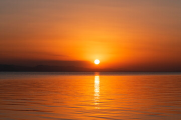 Fototapeta na wymiar Beautiful golden sunset over the lake. Sunset landscape.