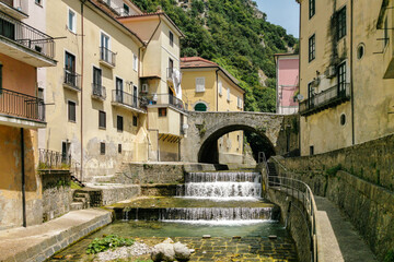 Scenic river with small waterfall crossing the town of Campagna in Salerno province, Campania...