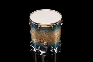 beautiful flour tom drum on a black background with reflection, for advertising and inscription