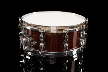 
beautiful snare drum on a black background with reflection, for advertising and inscription