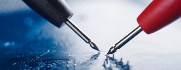 Measuring electronic signal from component on the PCB. Electronics repair and digital technology.