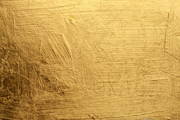 Grunge Gold and bronze glitter color smear painting wall. Abstract glow shine background.