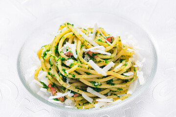 spaghetti with bacon, parsley and parmesan cheese