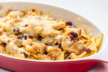 nachos with chicken meat, red beans and cheese