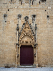 Fototapeta na wymiar imagen puerta de monasterio con las paredes de piedra 