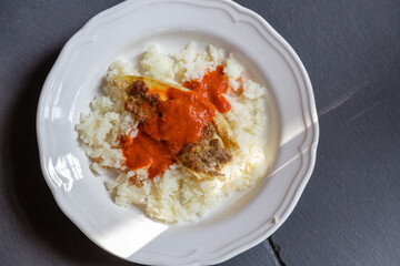pepper filled with minced meat with tomato sauce and rice