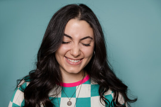 Portrait Happy, Beautiful Young Woman With Black Hair Laughing