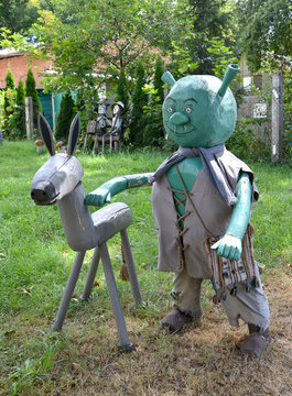 KALININGRAD REGION, RUSSIA - JULY 24, 2022: Wooden sculptures Shrek and donkey