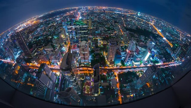 4k Time lapse aerial view of Bangkok city overlook Bangkok city, tiny world, high rise building, road, fish eyes lenses, Tourist destination in Thailand.