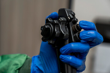 Endoscopic examination in the clinic. Doctor holding an endoscope before a colonoscopy. Medical...