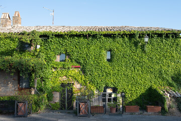 Ancient buildings of bricks of stones in sunny summer day on a background of the sky with lots of...