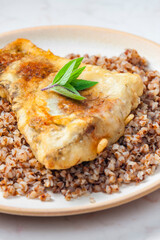 fried carp with bulgur and mint