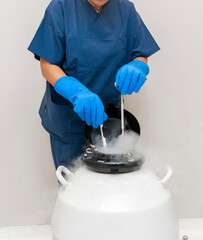 Embryologists a Liquid Nitrogen Bank Containing Sperm and Eggs Samples. ivf in vitro fertilization,...