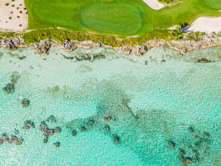 aerial view of golf course by the ocean
