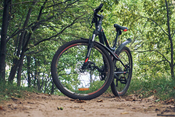 Fototapeta premium Mountain bike for outdoor activities, bicycle wheels, selective selective focus. Outdoor cycling