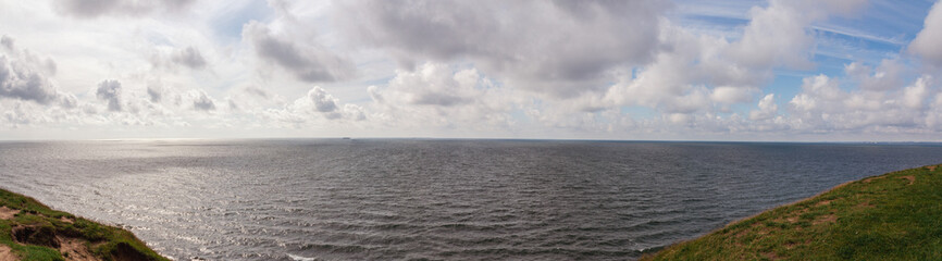 Panorama of dramatic summer cloud sky above the baltic sea seen from Ales stenar in Skåne (Scania) Sweden
