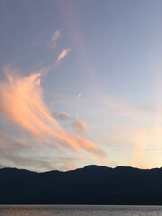 Naklejka na ściany i meble Sunset clouds over a mountain