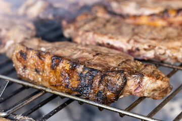 ribeye steak being prepared on the barbecue