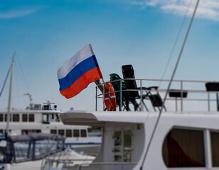 The Russian flag on the stern of the yacht.