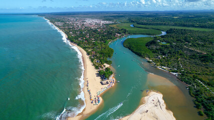 Fototapeta na wymiar Aerial view of Caraiva beach, Porto Seguro, Bahia, Brazil. Colorful beach tents, sea and river