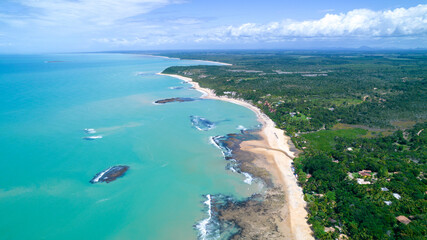 Aerial view of Praia do Espelho, Porto Seguro, Bahia, Brazil. Natural pools in the sea, cliffs and greenish water