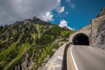 Flexenass road rising up from Lechtal in austria on a summer day. Crazy winding road from the...