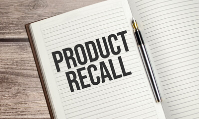 PRODUCT RECALL words on brown diary on wooden background