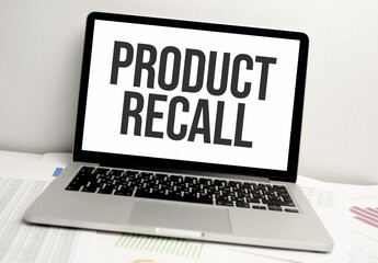 word PRODUCT RECALL on laptop and charts on white background