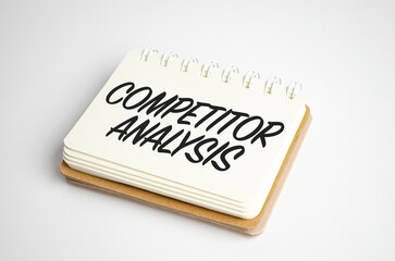 white notepad with the inscription - COMPETITOR ANALYSIS