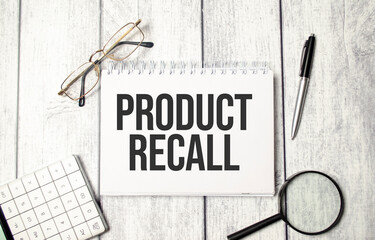 PRODUCT RECALL text on the notepad and calculator