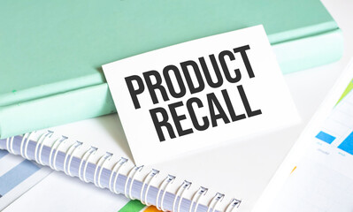 PRODUCT RECALL text on office desk and charts
