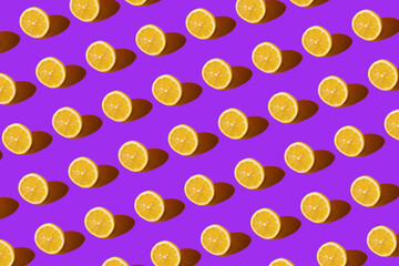 Lemon pattern on purple background. Pop art design, creative citruses. Yellow lemon, minimal flat style.