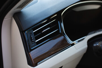 Obraz na płótnie Canvas Air vent grill in luxury car. Сar air conditioner, buttons, display. 