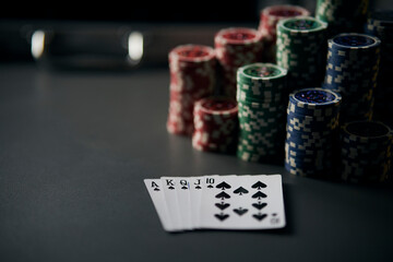 Poker Hands Royal Flush. Five playing cards - the poker royal flush hand. Royal Flash, card deck, poker royal flush on cards and poker chips on casino table. success in gambling. soft focus