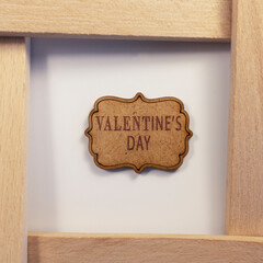 Valentine's day written on wooden surface. Wooden concept. Celebrations and special occasions.