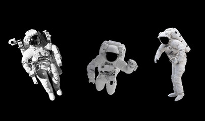 Space suits isolated on black background with clipping path. Elements of this image furnished by...