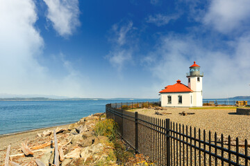 Alki Point Lighthouse on a sunny day. The lighthouse is an active aid to navigation located on Puget Sound's Alki Point, the southern entrance to Seattle's Elliott Bay, King County, Washington.