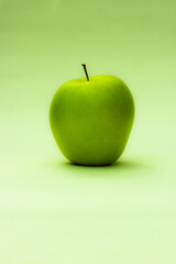 Green apple shot in portrait for use in flyers or backgrounds like smartphones 