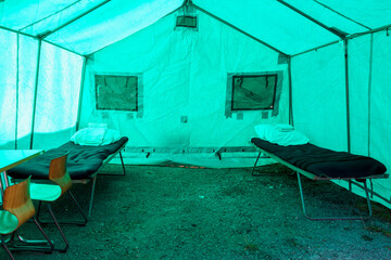 View inside the medical tent of a field hospital for emergencies. Background with selective focus and copy space