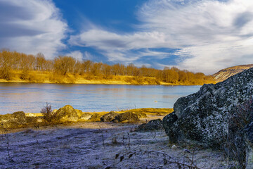 The beauty of winter nature with stones and frost. Background with copy space