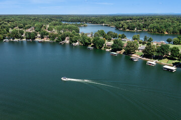 Aerial view of a pontoon boat on beautiful Tims Ford Lake in Tennessee.