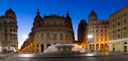 Obraz premium Image of night light of The Ferrari Square which is main city square in Genoa in Italy outdoors.