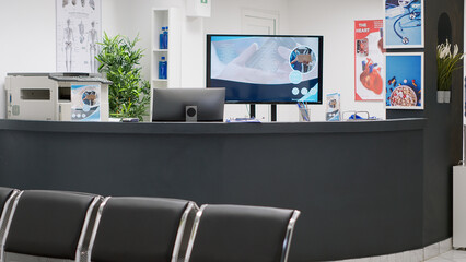 Waiting room lobby with empty reception counter desk to give help and support to patients with consultation appointments. Professional treatment space with checkup visits and clinical exam.