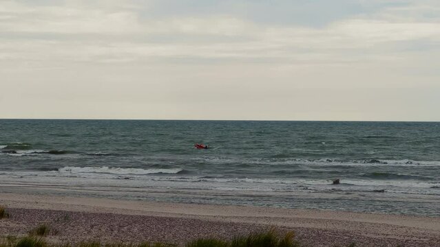Bad weather: Real missing drowned body rescue mission with an emergency service lifeguard boats involved