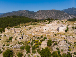 Drone photo of ruins of ancient city Rhodiapolis with view of amphitheater. Antalya Province, Turkey.