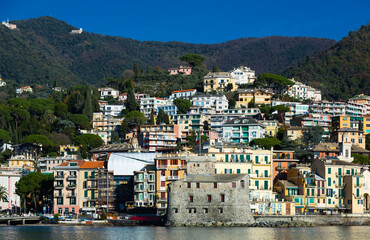 Fototapeta na wymiar Landscape of Italian town of Rapallo with castle on Ligurian seaside, Italy
