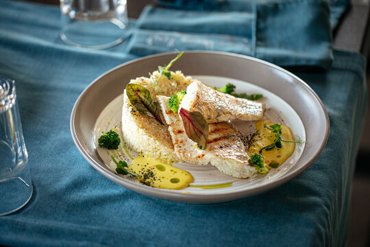 Restaurant gourmet pike perch fillet with couscous and bearnaise sauce