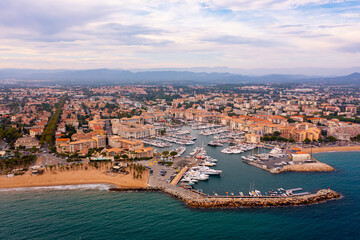Aerial cityscape of France city Frejus with yachts in the harbor